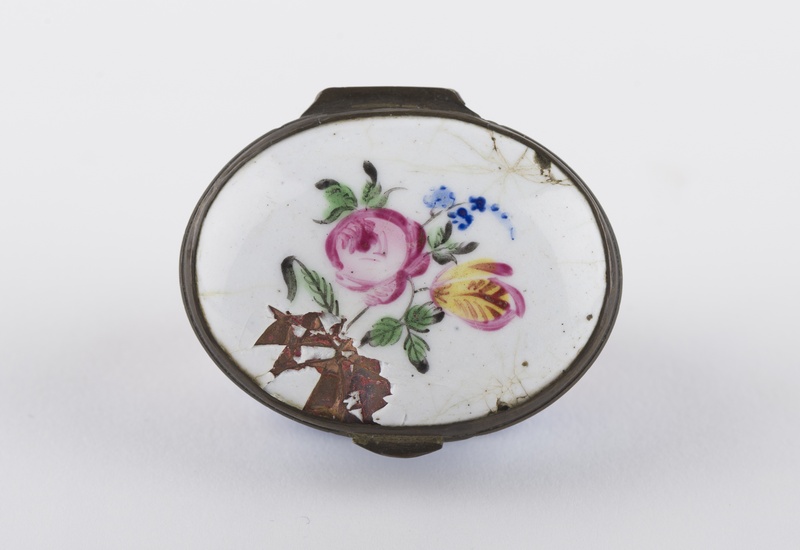 Patch box lid with a spray of flowers against a white background